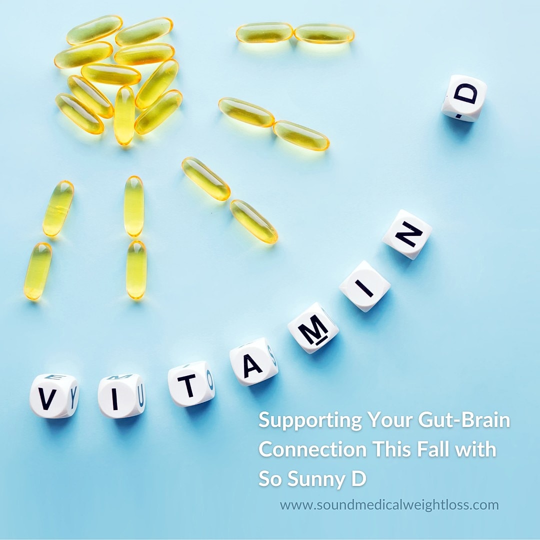 Vitamin D capsules arranged on a blue background.
